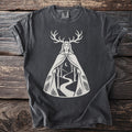 Dark grey t-shirt with a white graphic of a woman with antlers, a forest, and a moon.