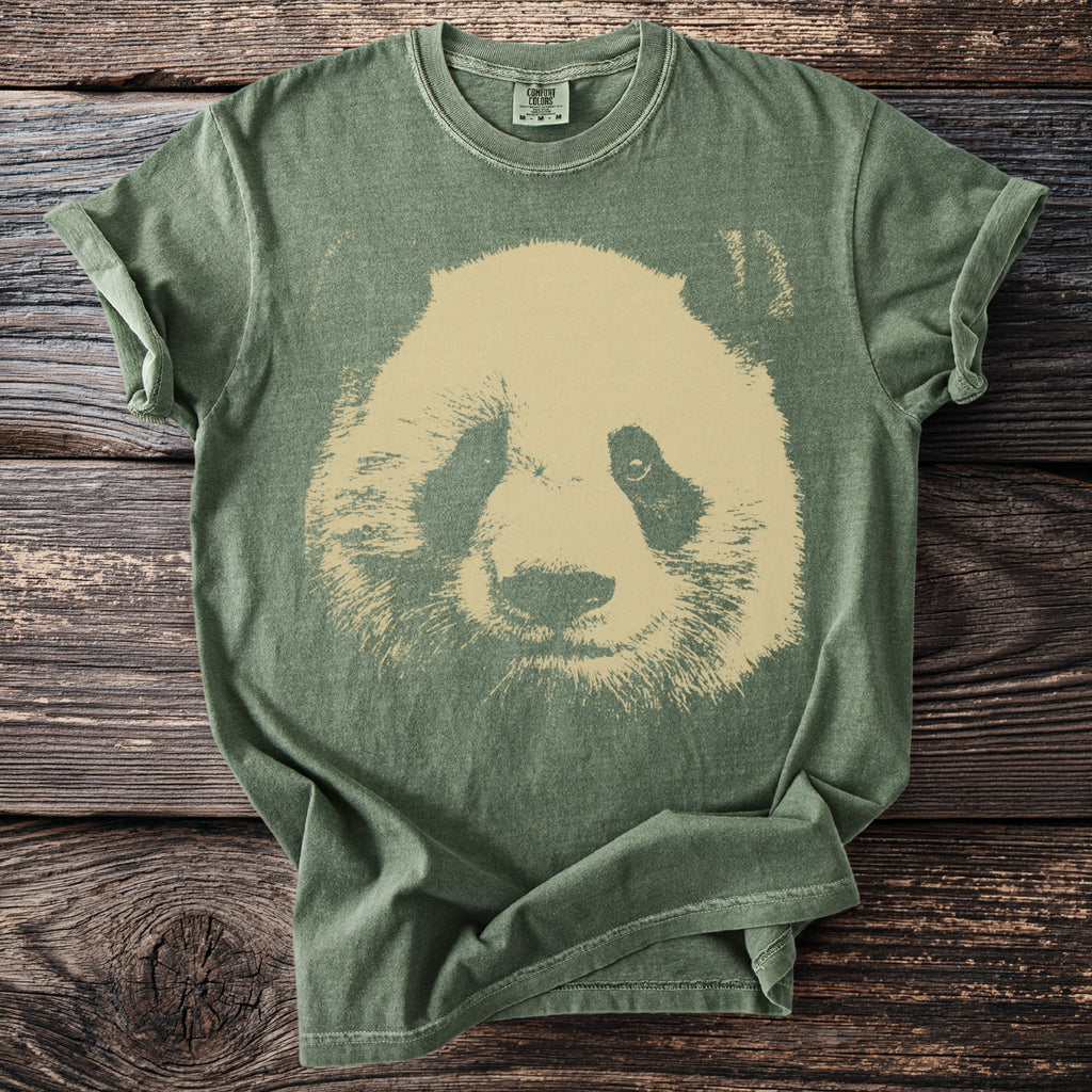 Green t-shirt with a distressed tan panda face graphic and Comfort Colors label.