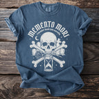 Blue t-shirt with "Memento Mori" text, skull, hourglass, rose, bones, and graves.