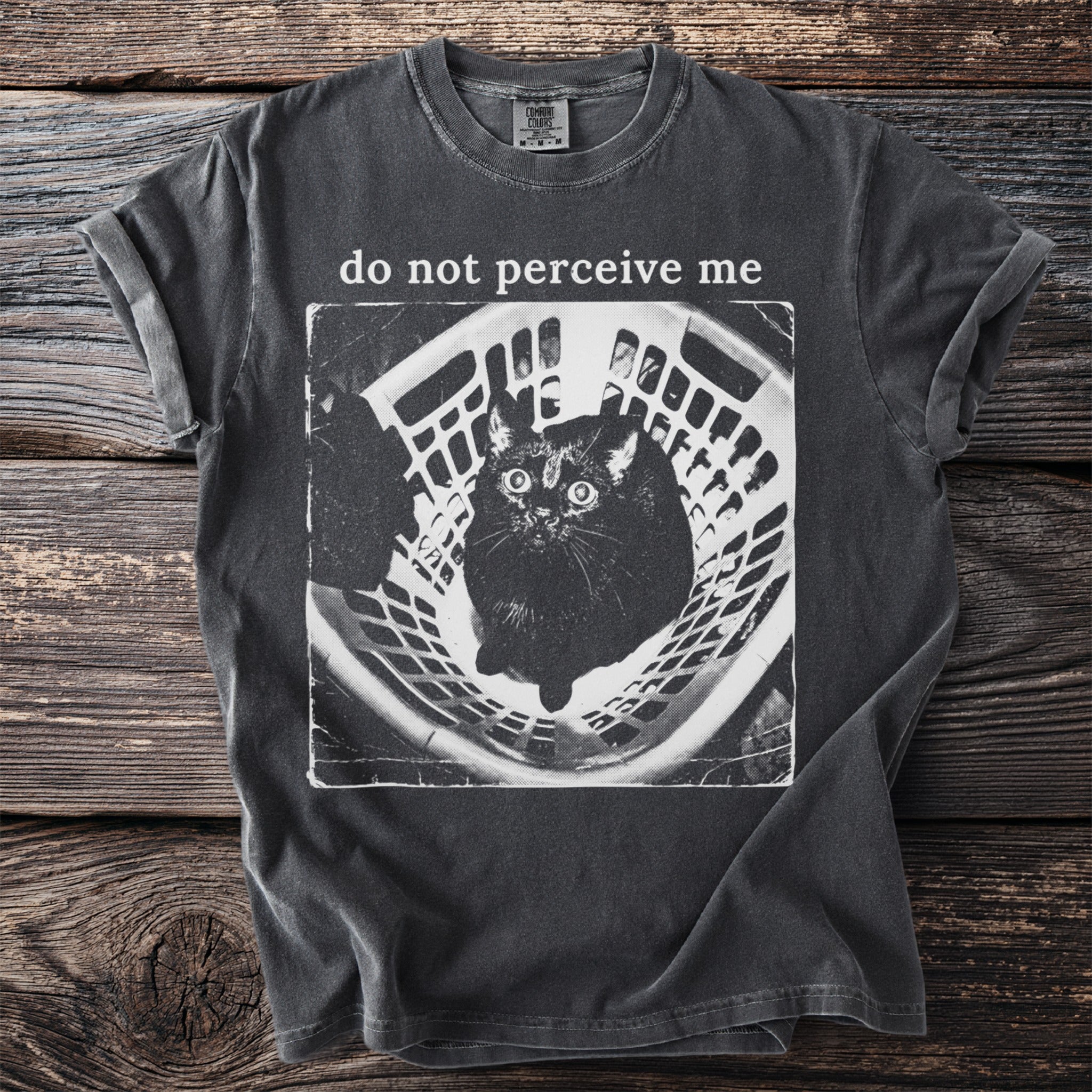 Black cat in a laundry basket with text "do not perceive me."