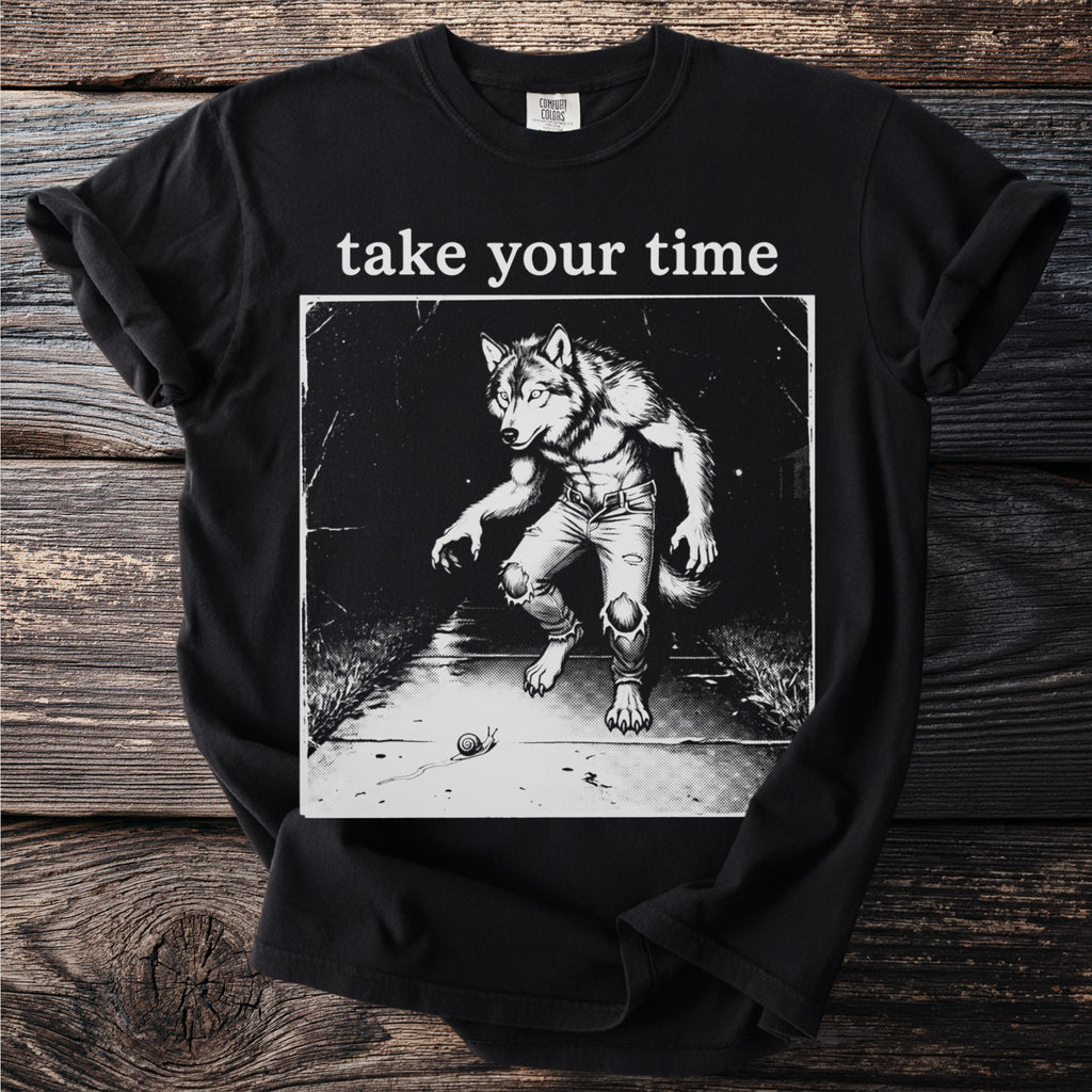 Black t-shirt with "take your time" and a werewolf with a snail on a sidewalk.