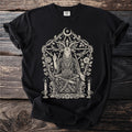 Black t-shirt featuring a detailed illustration of a seated goat-headed figure within a floral and pentagram frame.