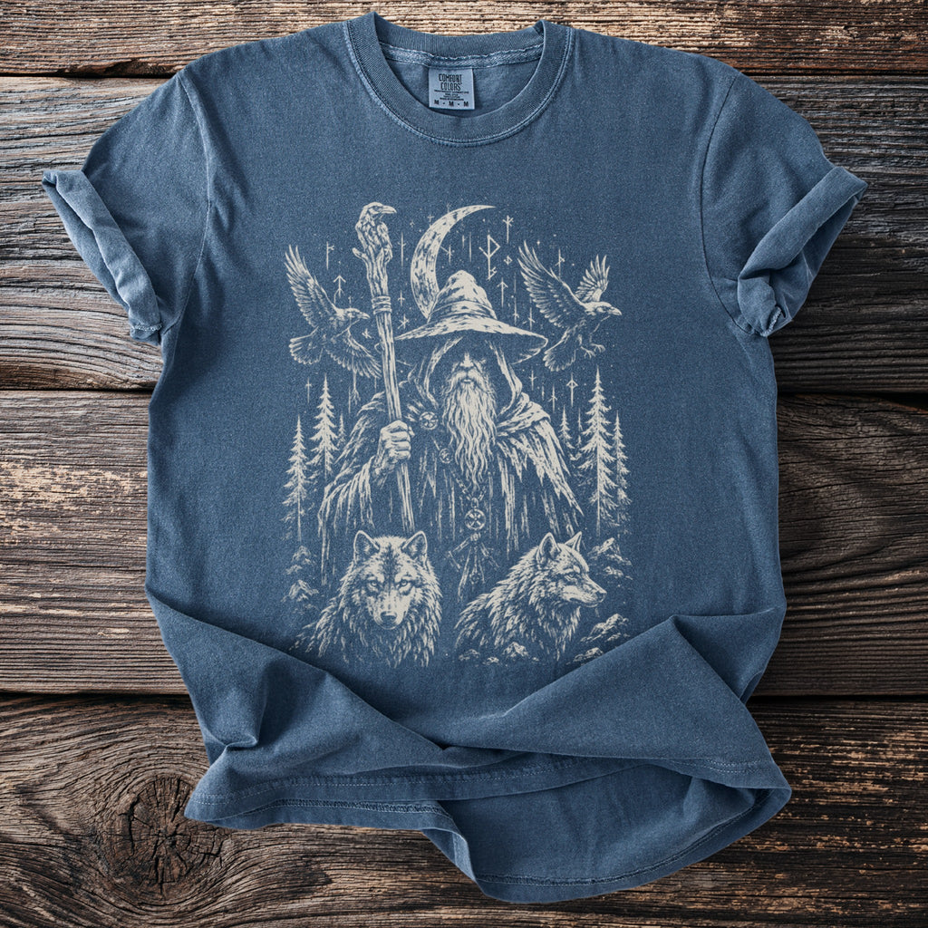 T-shirt with a graphic of a wizard, wolves, birds, trees, and Norse runes.