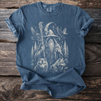 T-shirt with a graphic of a wizard, wolves, birds, trees, and Norse runes.