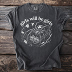 T-shirt with spiderwebs, a spider, a cocoon, and the text "girls will be girls".