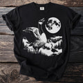 Black t-shirt with a graphic of two geese in a mountain landscape under a full moon.