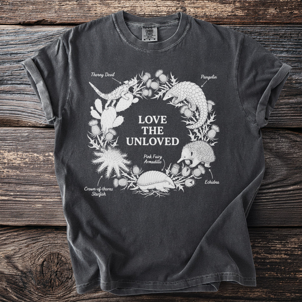 Dark grey t-shirt with "Love The Unloved" and illustrations of animals.