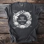 Dark grey t-shirt with "Love The Unloved" and illustrations of animals.