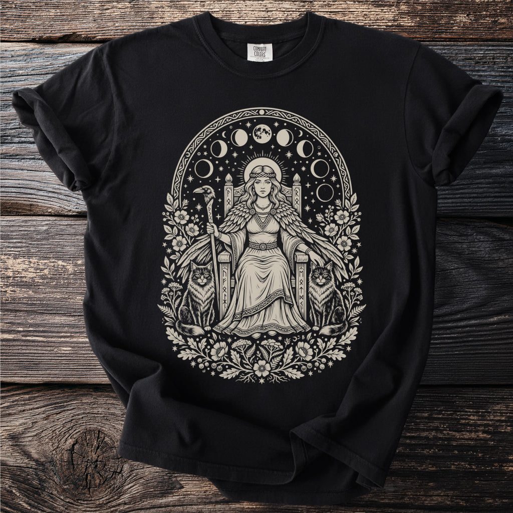 Black t-shirt with a monochrome pagan-inspired print of a queen on a throne with cats and a crow.