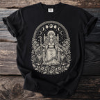 Black t-shirt with a monochrome pagan-inspired print of a queen on a throne with cats and a crow.