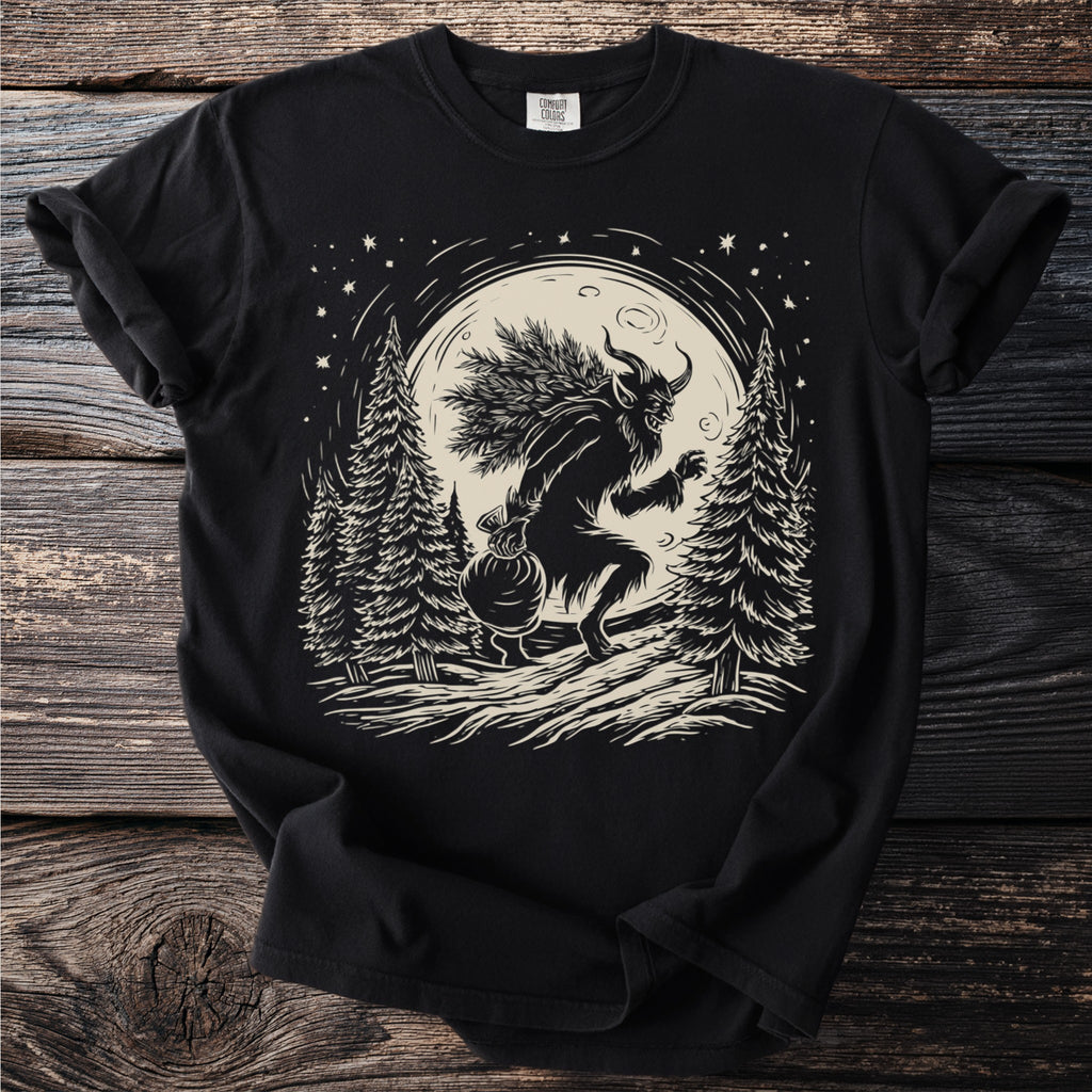 Black t-shirt with a Krampus illustration carrying pine branches and a sack.