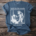 Blue t-shirt with white text and graphic of a werewolf at a machine.