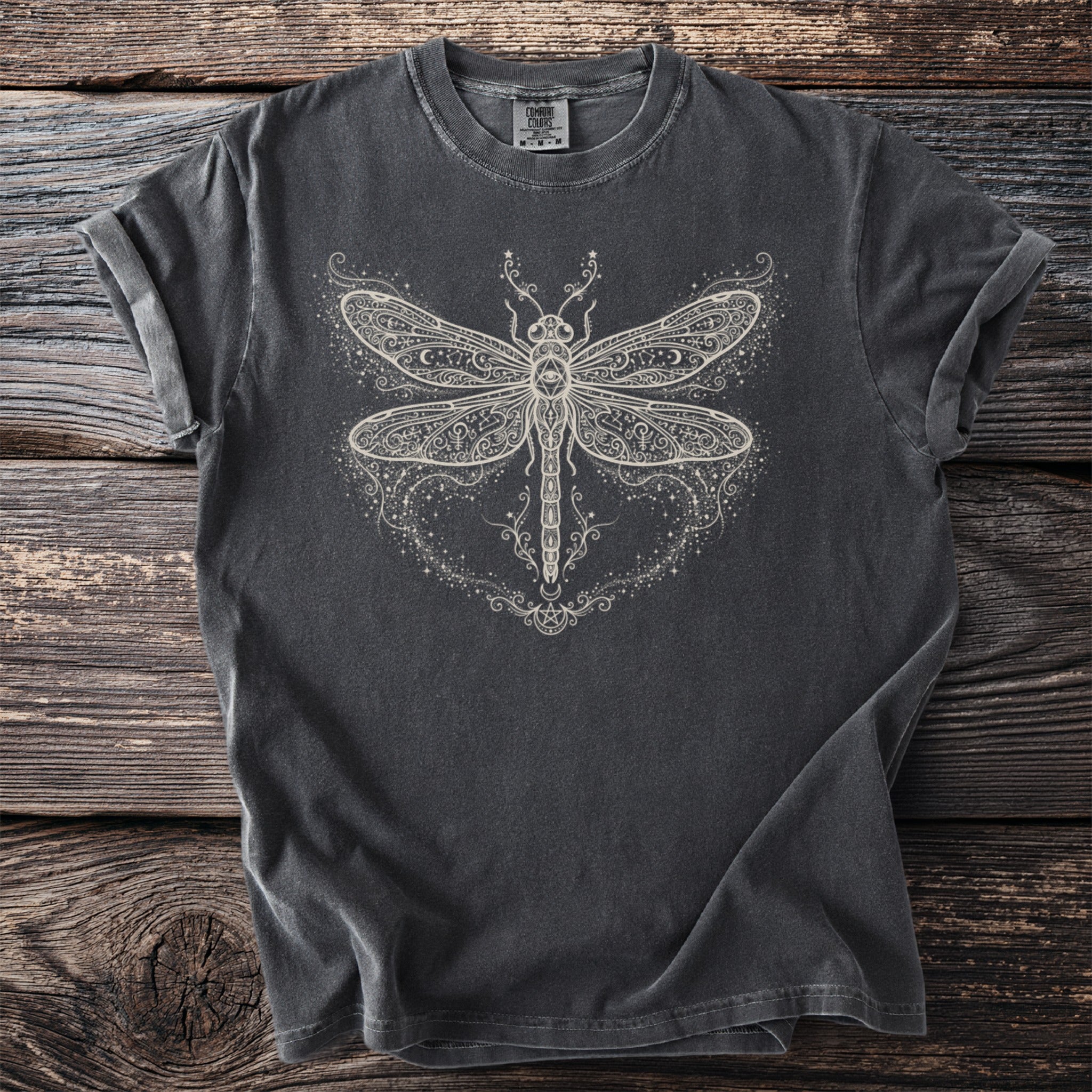 Dark grey t-shirt with a white, ornate dragonfly graphic featuring stars and celestial details.