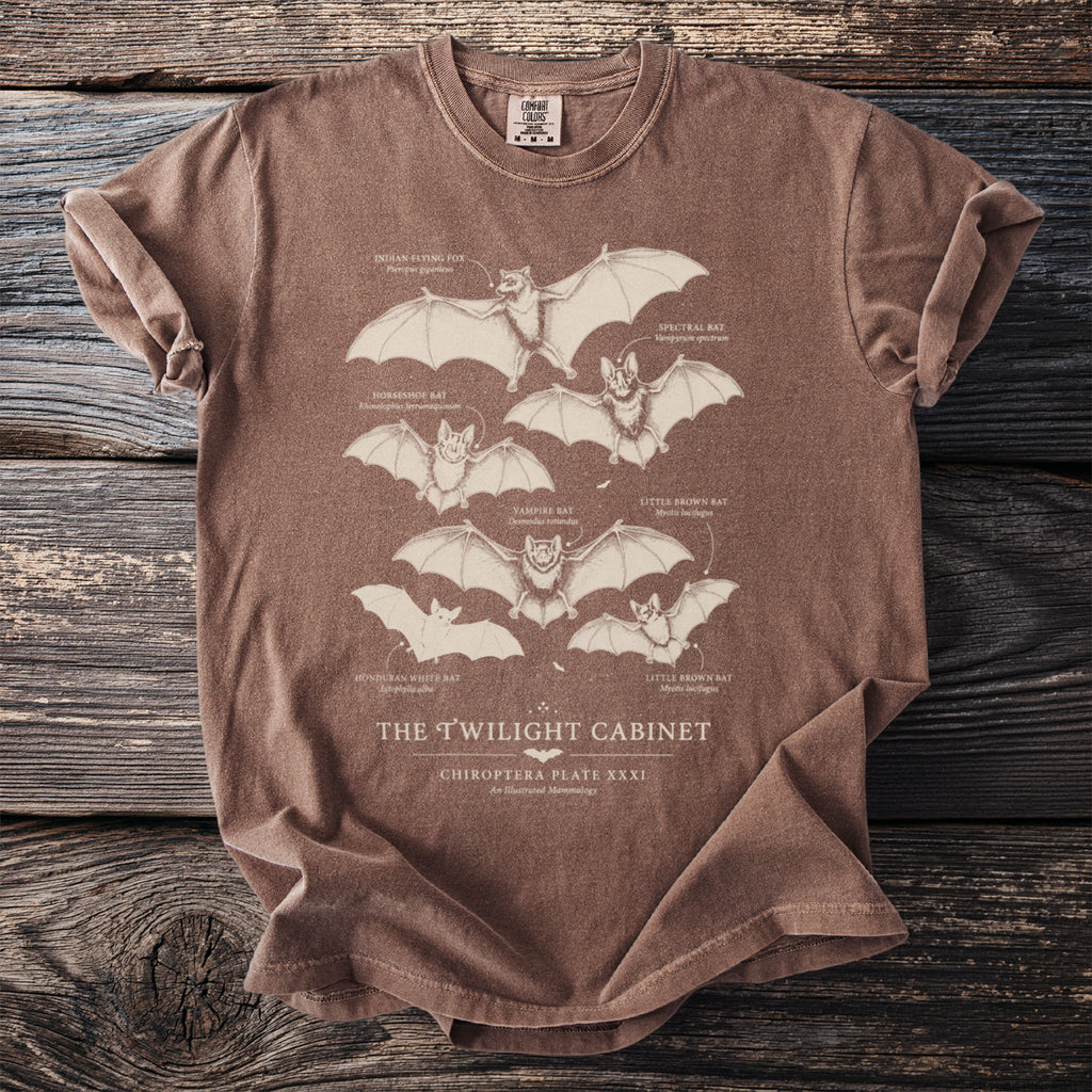 Brown t-shirt with illustrations of six different bat species and their labels.