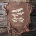 Brown t-shirt with illustrations of six different bat species and their labels.