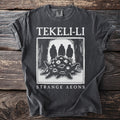 Dark gray t-shirt with "Tekeli-Li Strange Aeons" and a creature with many eyes.