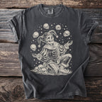 T-shirt with a skeleton jester surrounded by skulls and stars graphic.