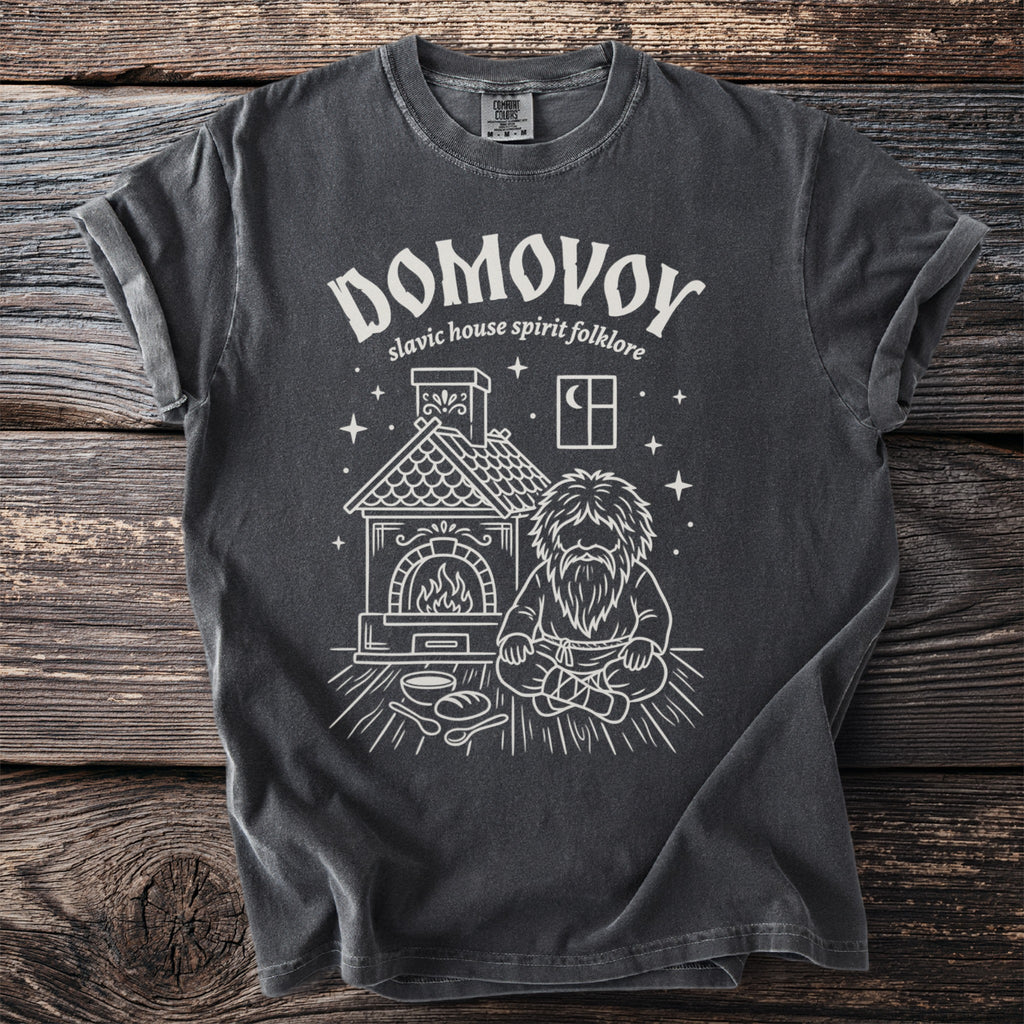 Domovoy graphic on a charcoal t-shirt with Slavic house spirit folklore text.