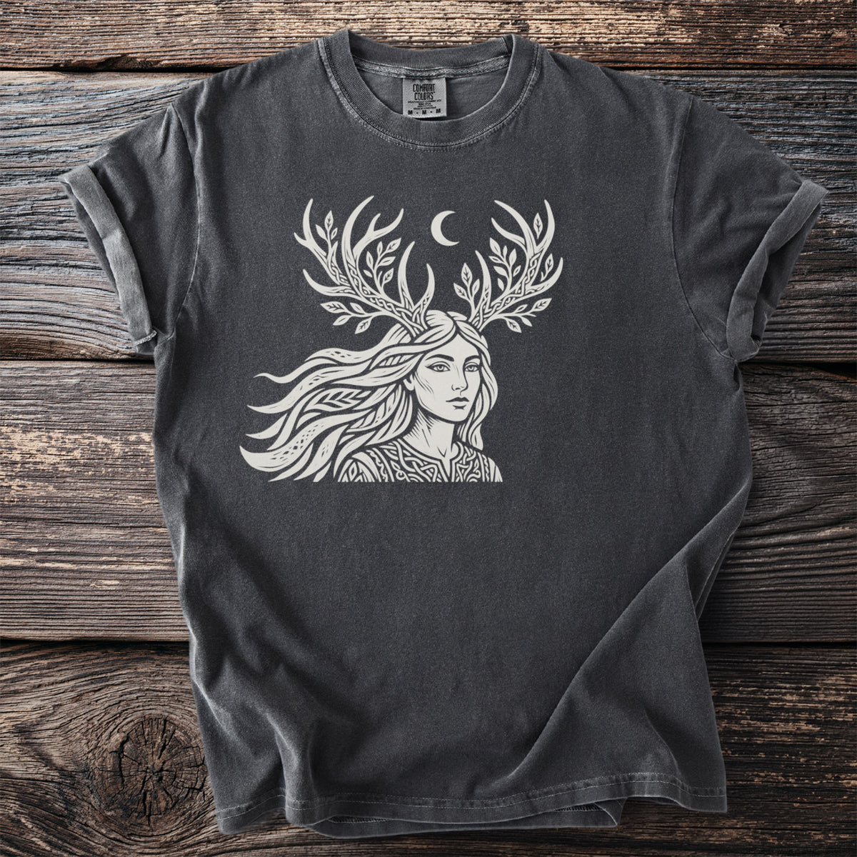 Dark grey t-shirt with a white line art graphic of a woman with antlers and a crescent moon.