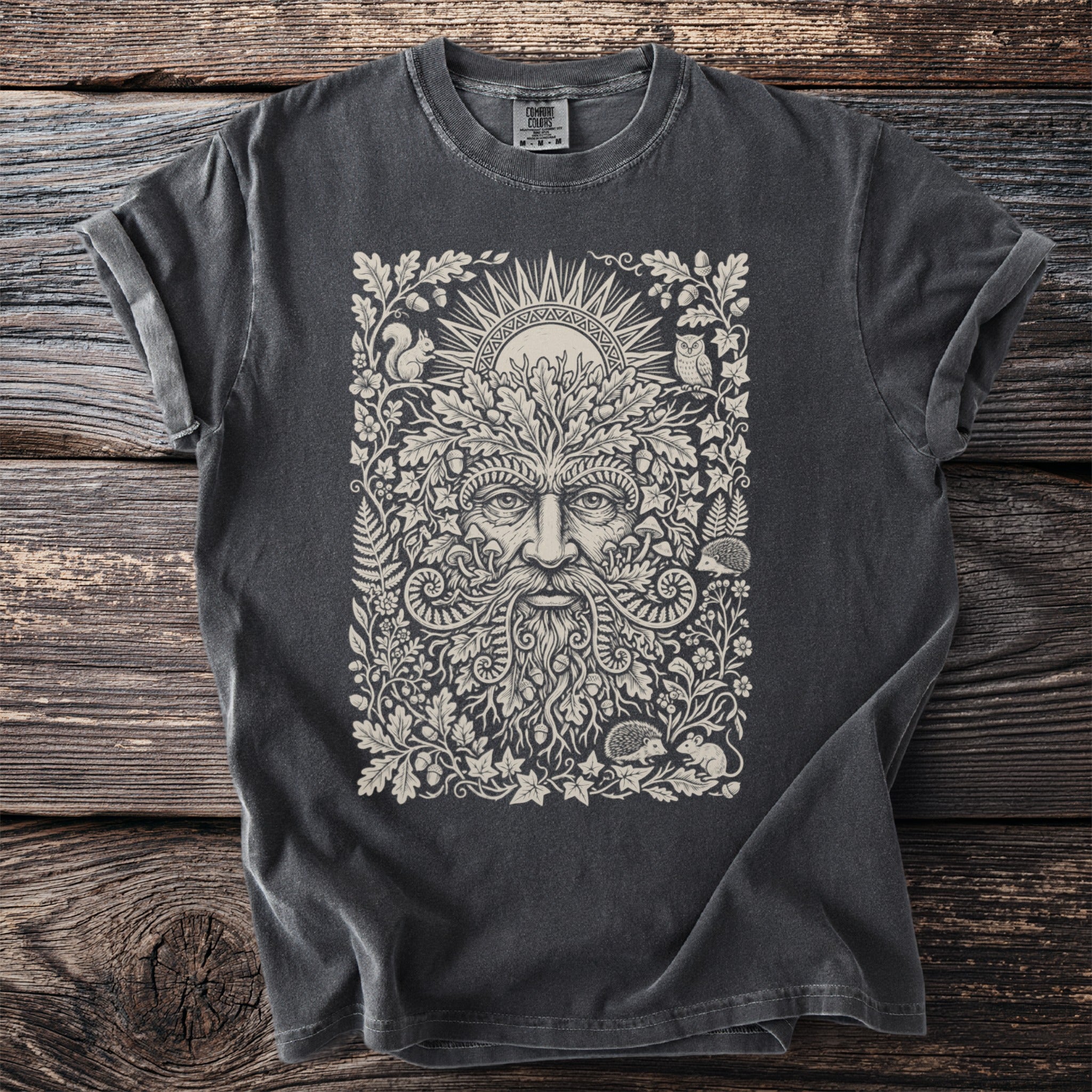 Dark grey t-shirt with a green man surrounded by nature and woodland creatures.