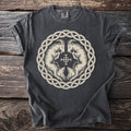 Dark grey t-shirt with a circular knot design featuring two goats and a cross.