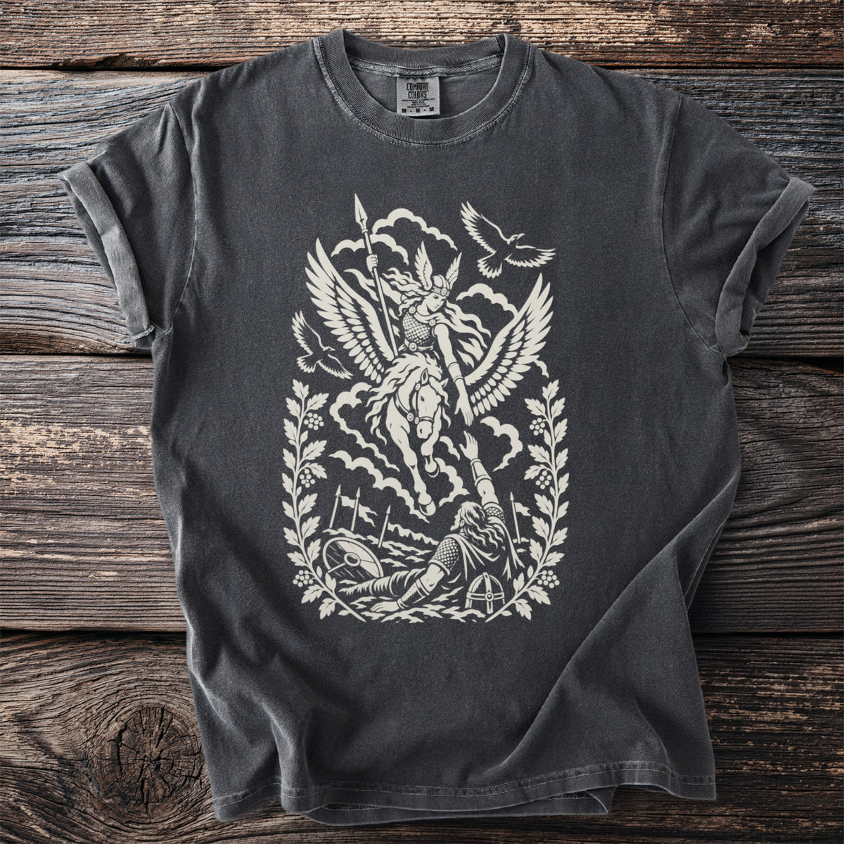Dark t-shirt with a cream graphic of a winged warrior on a horse above a fallen figure.