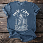 Blue t-shirt with white Santa Muerte graphic and text.
