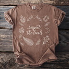 Brown t-shirt with "respect the locals" text and botanical illustrations.