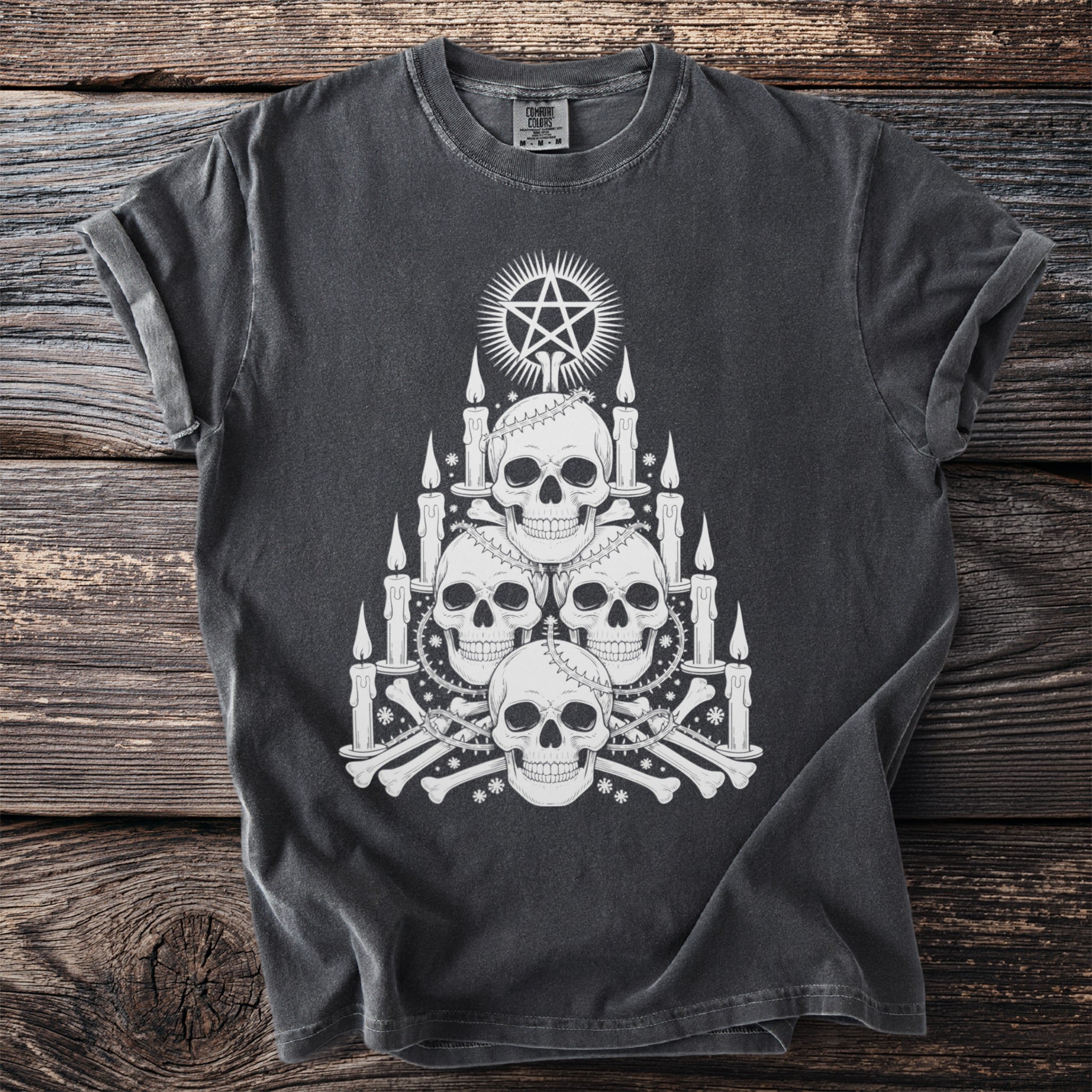 Dark grey t-shirt with stack of skulls, candles, bones, and pentagram.