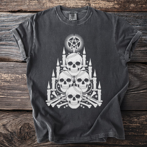 Dark grey t-shirt with stack of skulls, candles, bones, and pentagram.