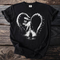 Black t-shirt with a white kraken eye and tentacles looming over a ship.