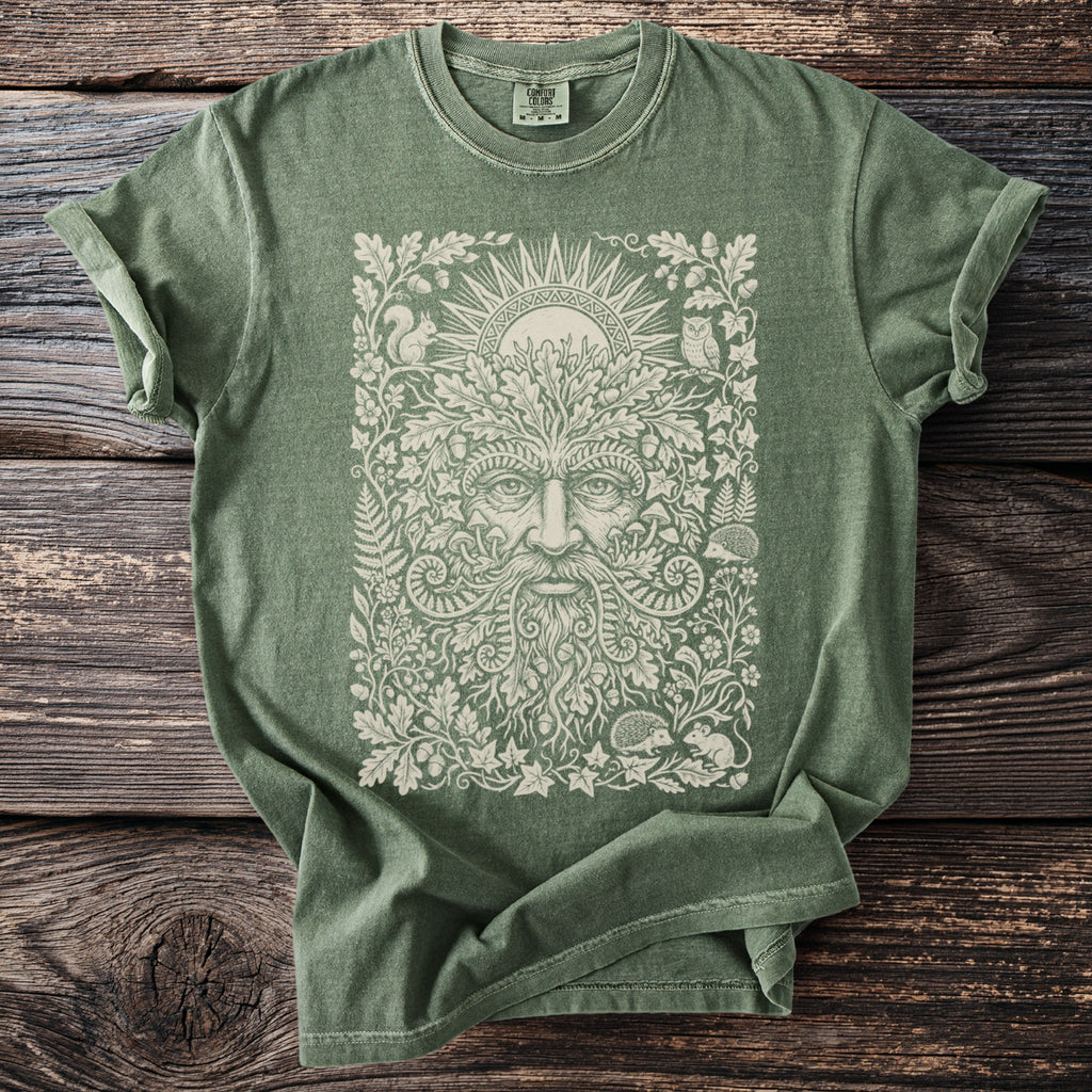 Green t-shirt with intricate forest spirit and woodland creatures design.