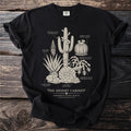 Black t-shirt with "The Desert Cabinet" botanical illustration of cacti and succulents.
