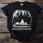 Black t-shirt with two ravens and "attempted murder" text.
