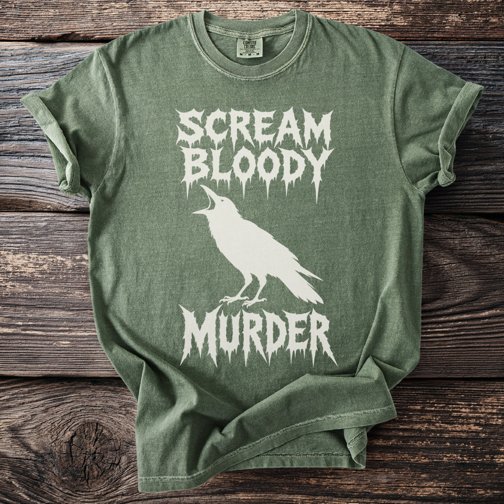 Green t-shirt with white crow graphic and text "SCREAM BLOODY MURDER".