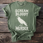 Green t-shirt with white crow graphic and text "SCREAM BLOODY MURDER".