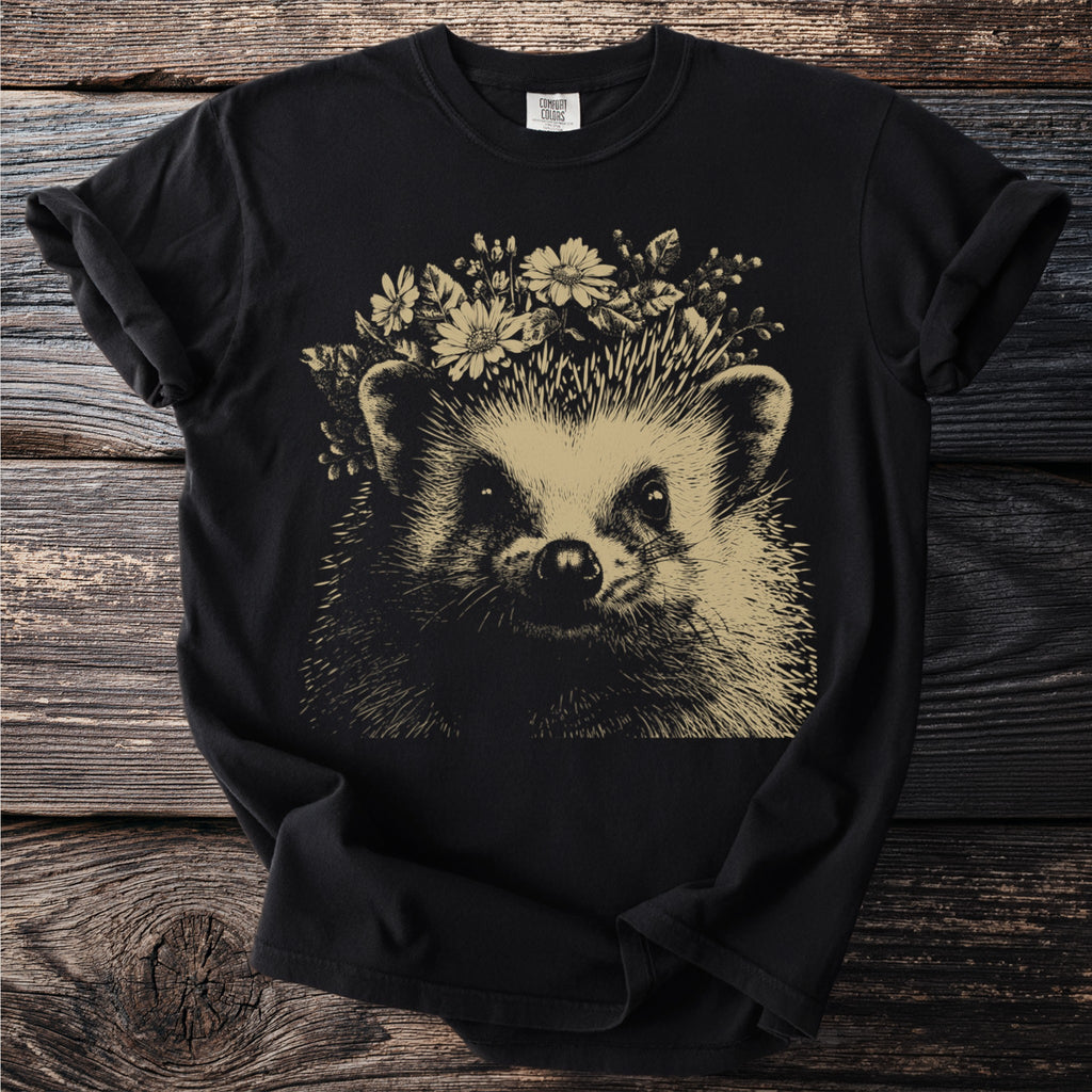 Black t-shirt with a line drawing of a hedgehog wearing a flower crown.