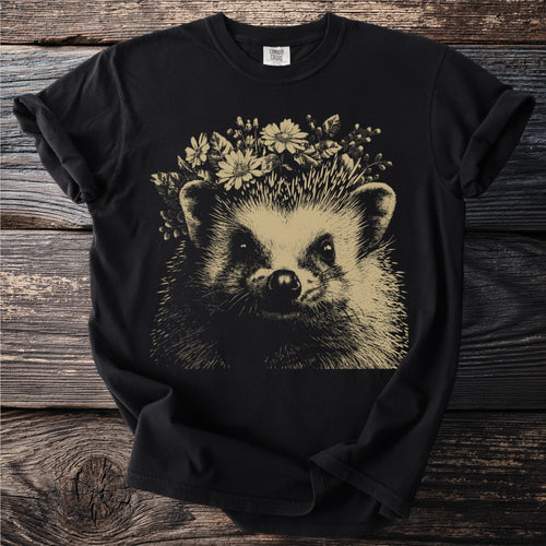 Black t-shirt with a line drawing of a hedgehog wearing a flower crown.