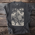 Graphic t-shirt with a Viking bear warrior holding an axe and shield with a wolf companion.