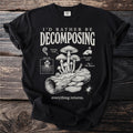 Black t-shirt with text "I'd Rather Be Decomposing" and mushroom illustrations.