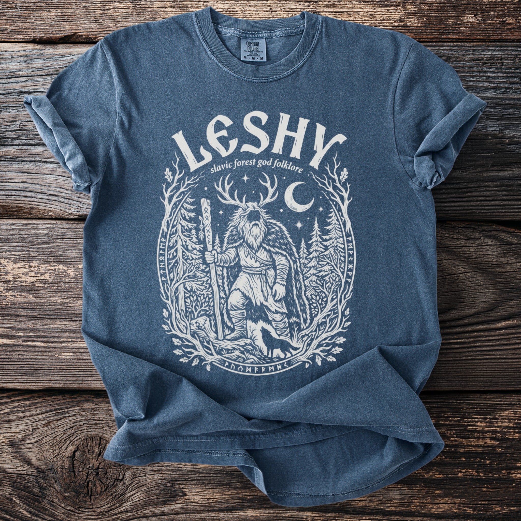 Blue t-shirt with white Leshy design: slavic forest god folklore.