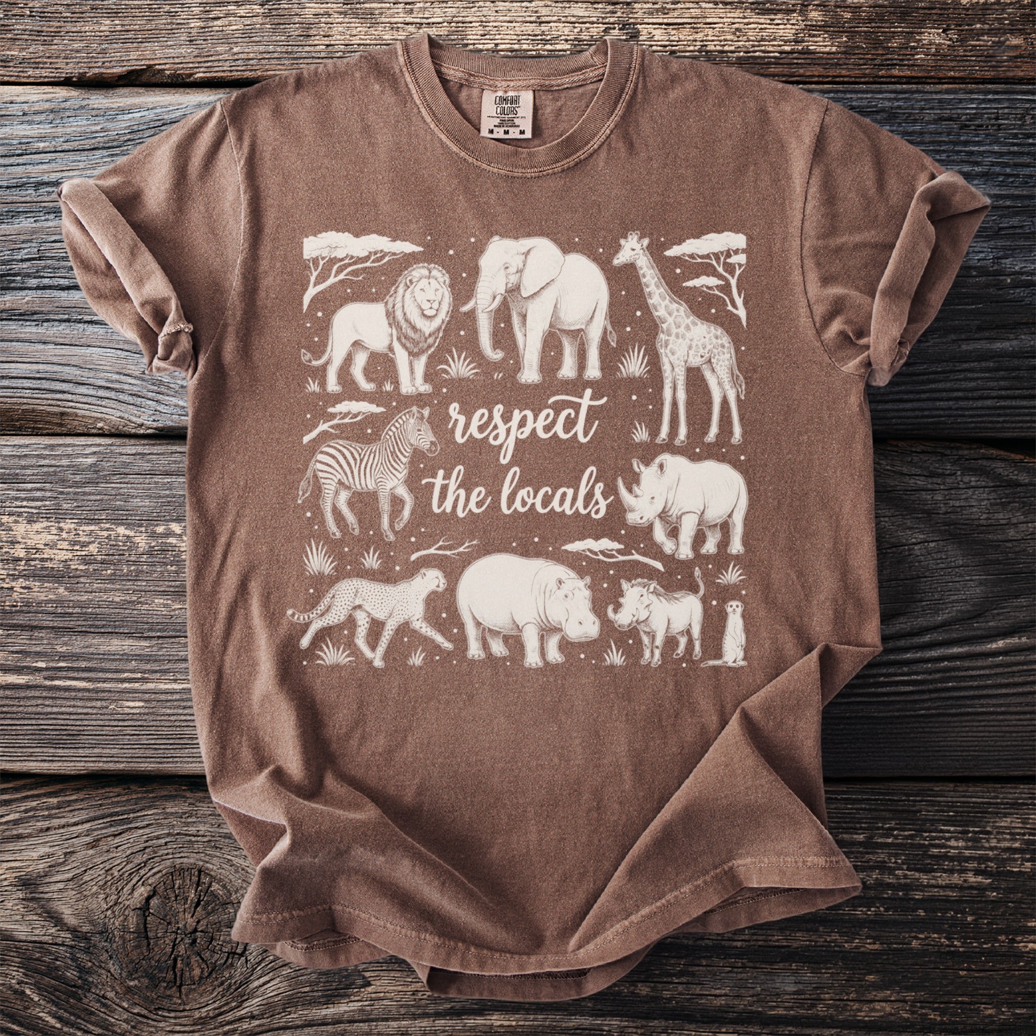 Brown t-shirt with white graphic of African animals and text "respect the locals."