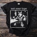 Black t-shirt with a wolf man text "not your type" and comic-style illustration.