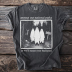 T-shirt with "protect our national parks or we'll haunt your backyard" and ghost design.