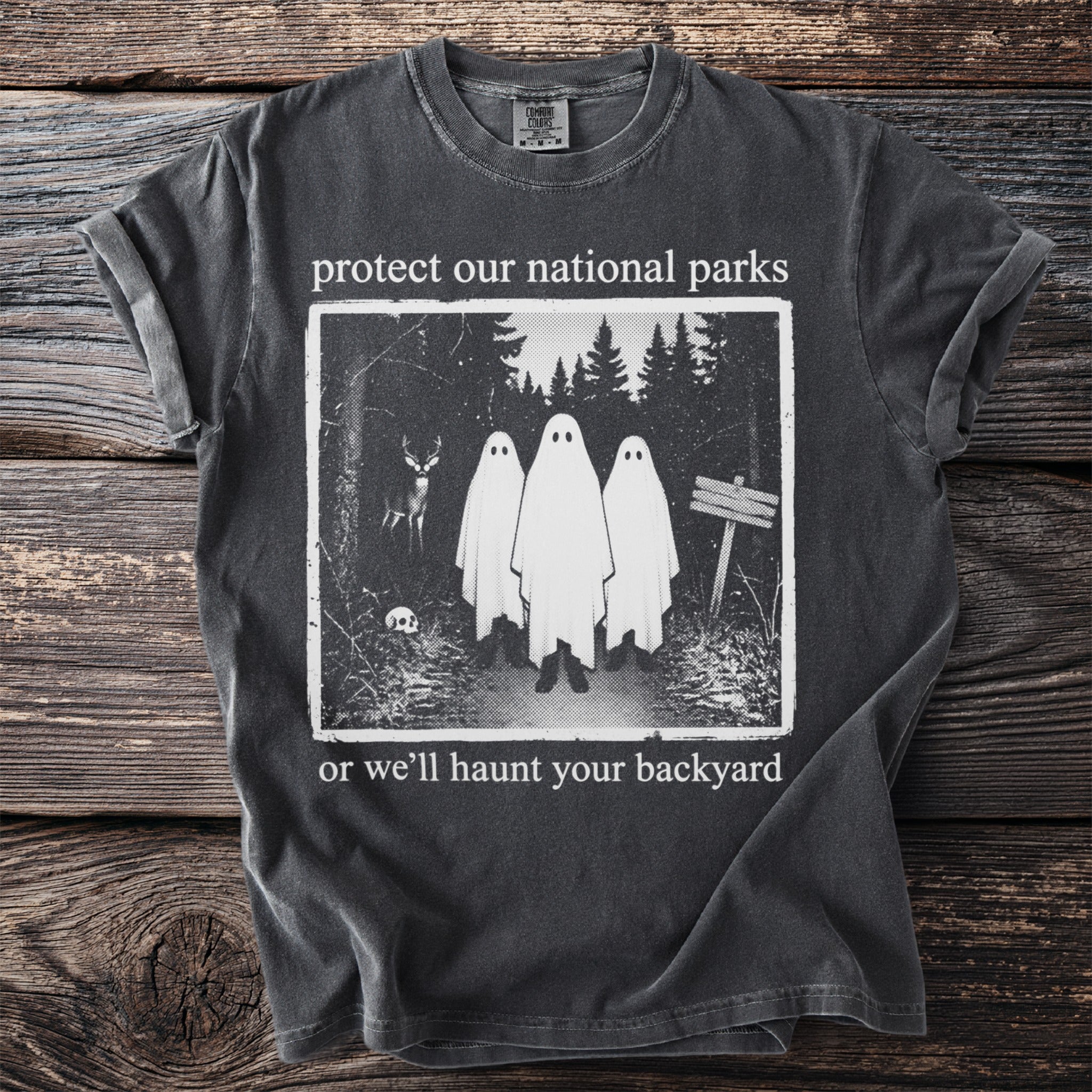T-shirt with "protect our national parks or we'll haunt your backyard" and ghost design.