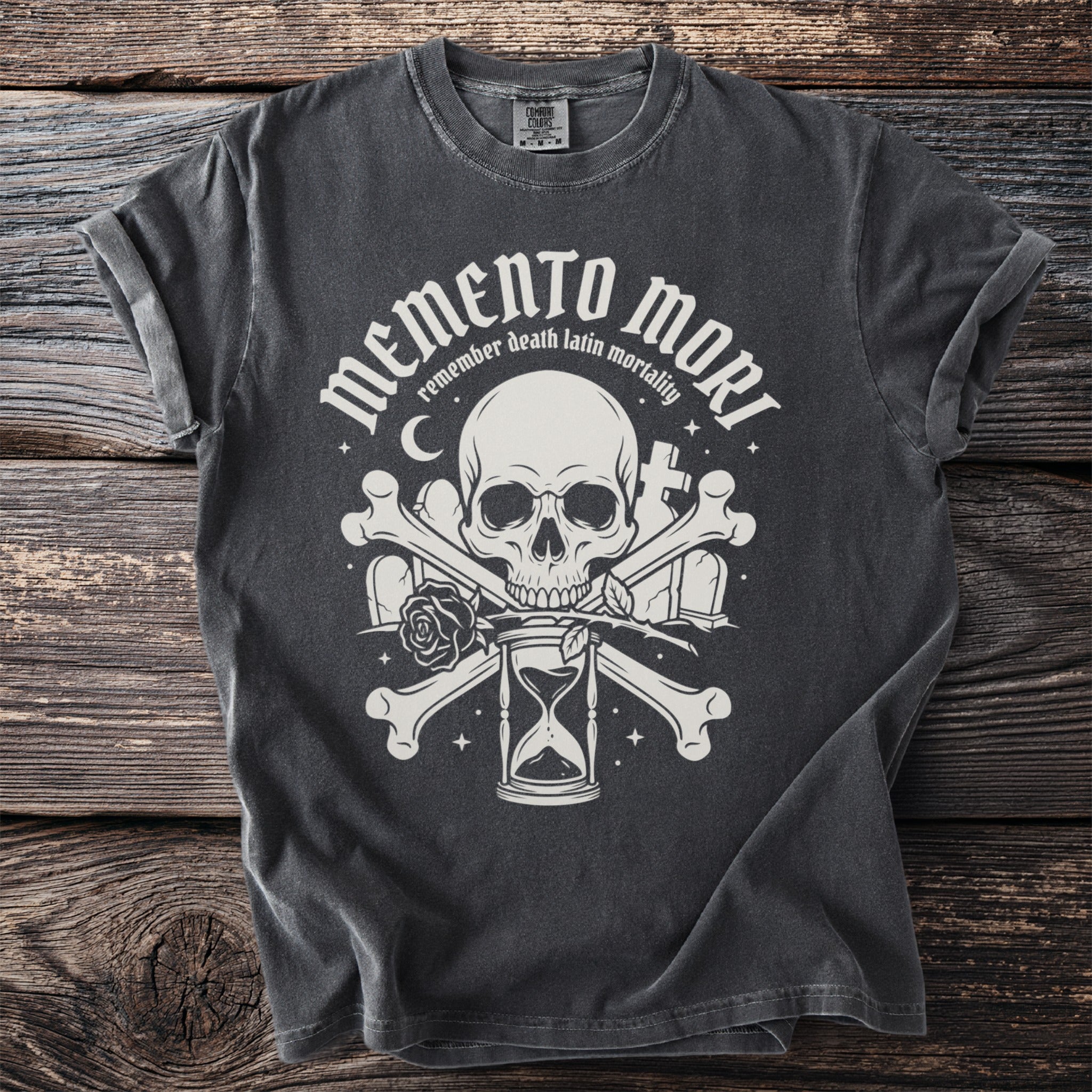 Dark grey t-shirt with Memento Mori design featuring skull, bones, rose, hourglass, and gravestones.