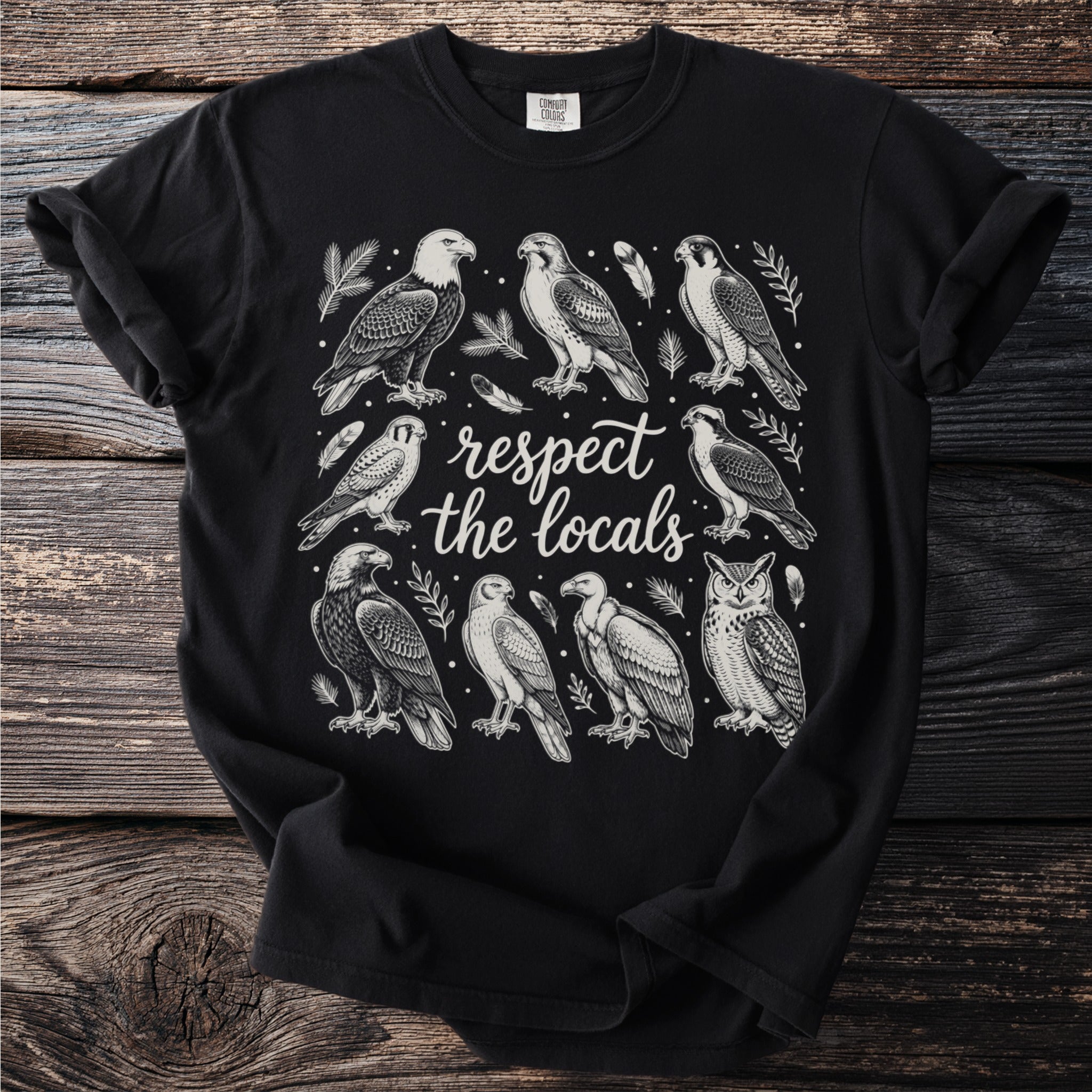 Black t-shirt with a vintage illustration of various birds and text "respect the locals".