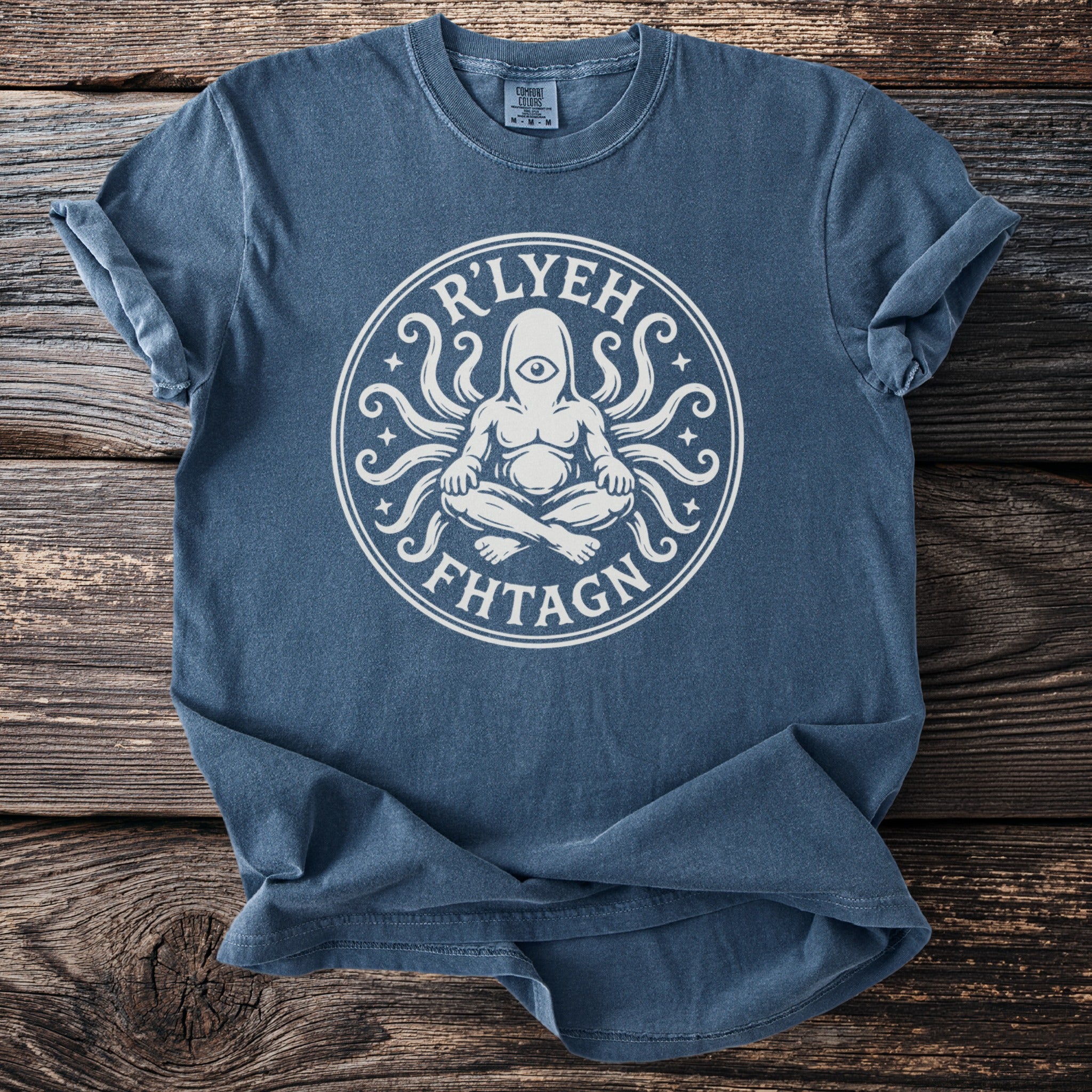 Blue t-shirt with white graphic of a meditating figure with tentacles and text "R'LYEH FHTAGN".