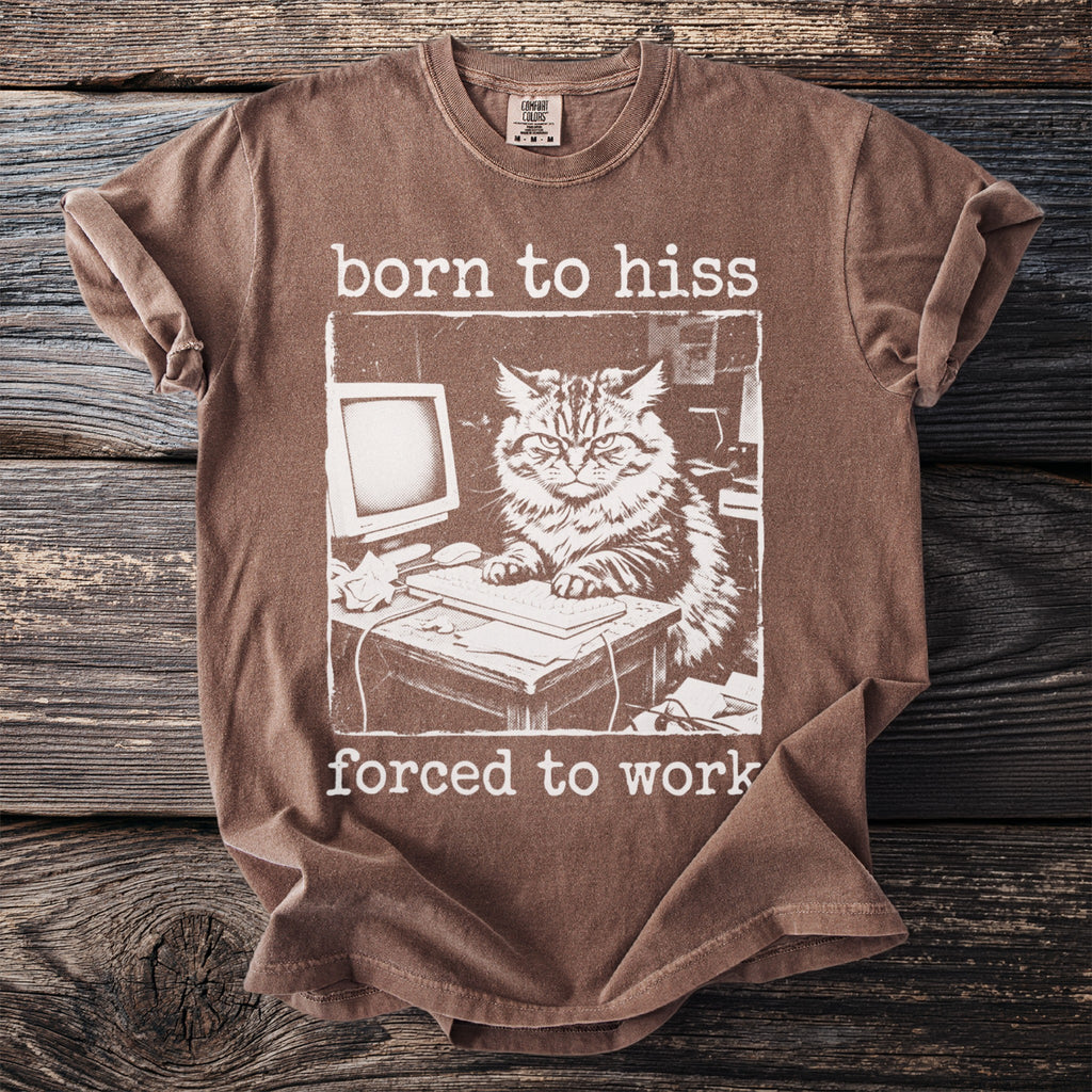 Brown t-shirt with white text "born to hiss forced to work" and a cat at a computer.