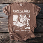 Brown t-shirt with white text "born to hiss forced to work" and a cat at a computer.